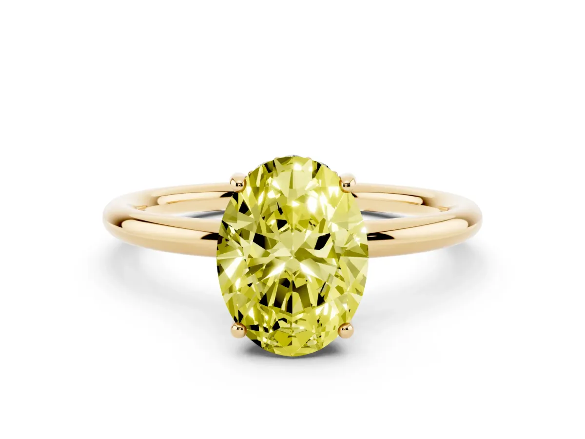 Fancy Yellow Oval Cut Solitaire Diamond Ring with a Classic Band and Four-Prong Setting Yellow gold