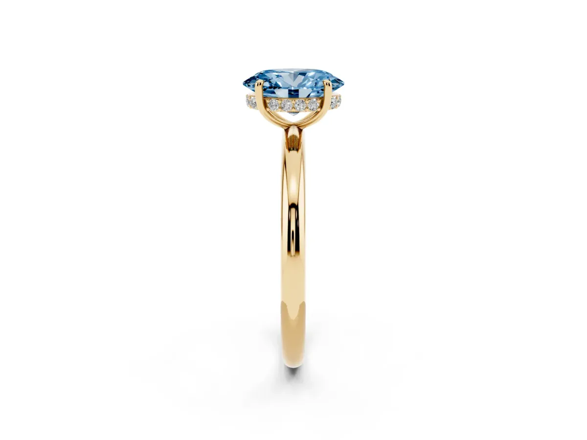 Fancy Blue Oval Cut Diamond Solitaire Ring with Thin Band and Four-Prong Setting Yellow gold