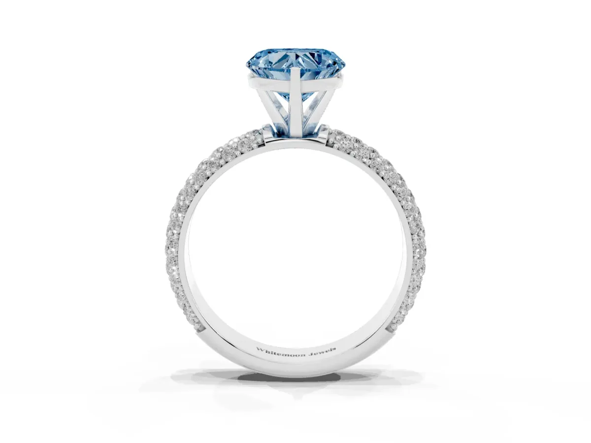 Fancy Blue Heart Cut Diamond Solitaire Ring with Prong Setting and Pavé Band Silver
