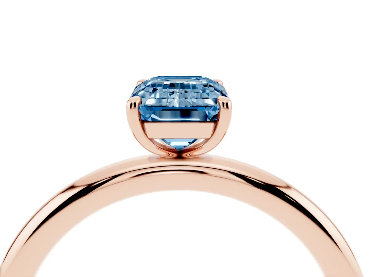 Fancy Blue Emerald Cut Solitaire Diamond Ring with Four-Prong Setting on a Plain Band Rose gold
