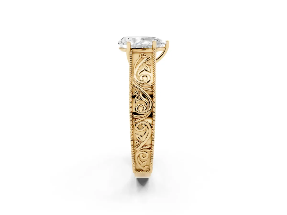 Pear Cut Diamond Solitaire Ring with Engraved Band and Four-Prong Setting Yellow gold
