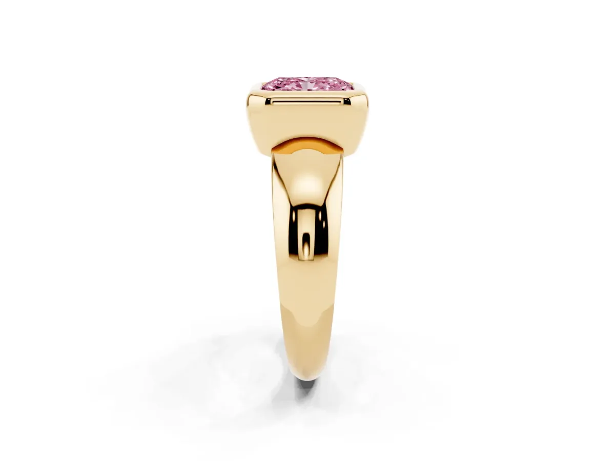 Fancy Pink Bezel Set Radiant Cut Solitaire Ring with Wide Band Yellow gold