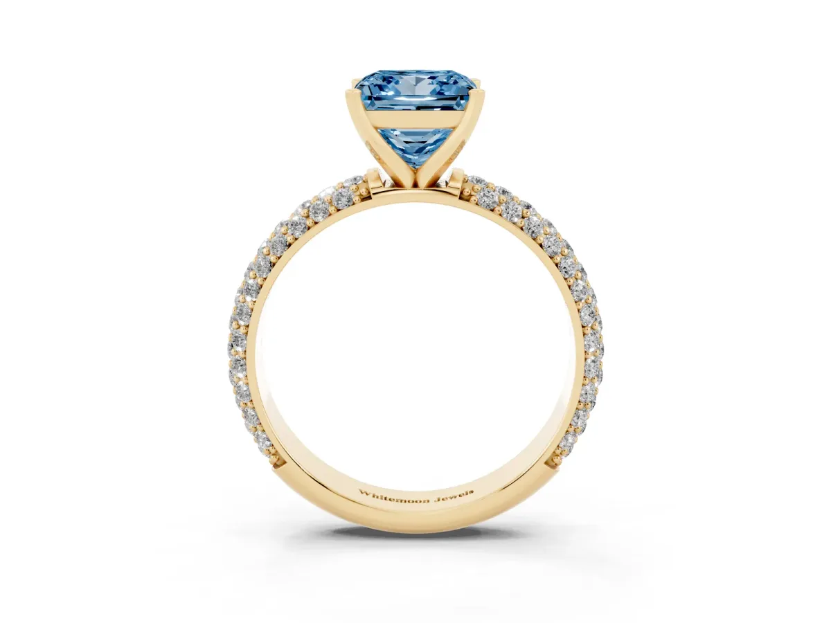 Fancy Blue Princess Cut Diamond Solitaire Ring with Prong Setting and Pavé Band Yellow gold