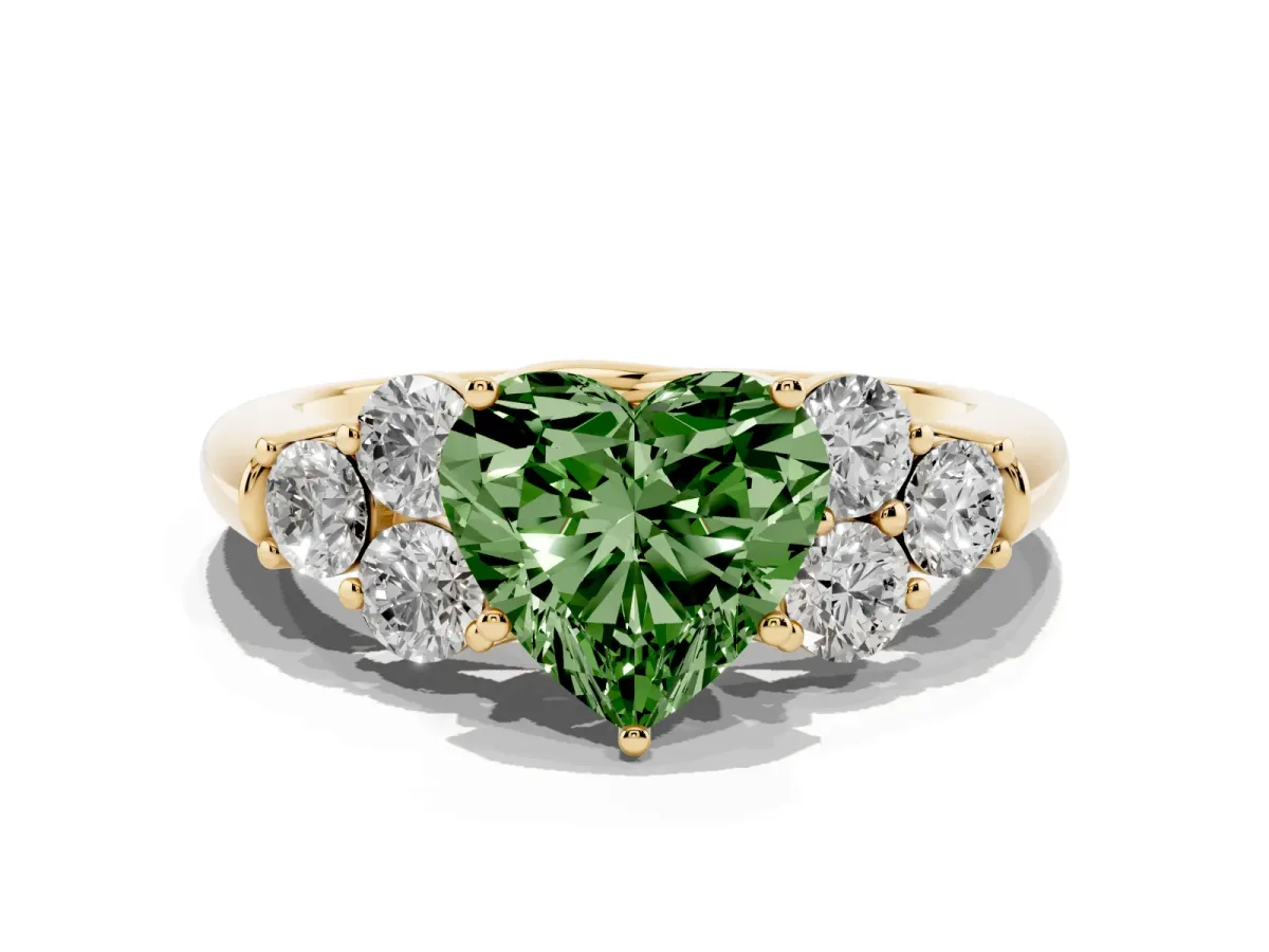 Fancy Green Heart Cut Cut Diamond Cluster Ring with Round Accent Stones and Prong Setting on a Classic Band Yellow gold