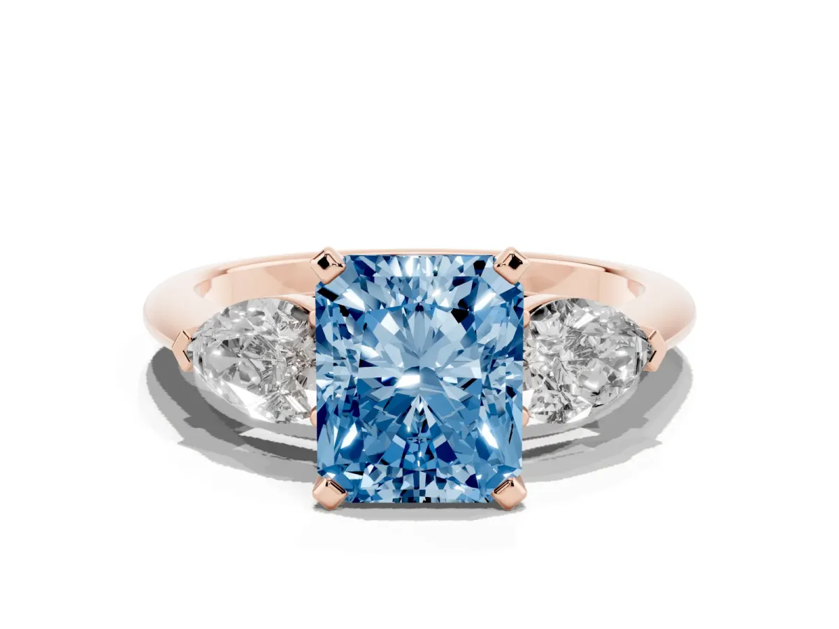 Fancy Blue Three-Stone Radiant Cut Diamond Ring with Pear Side Stones and Four-Prong Setting Rose gold