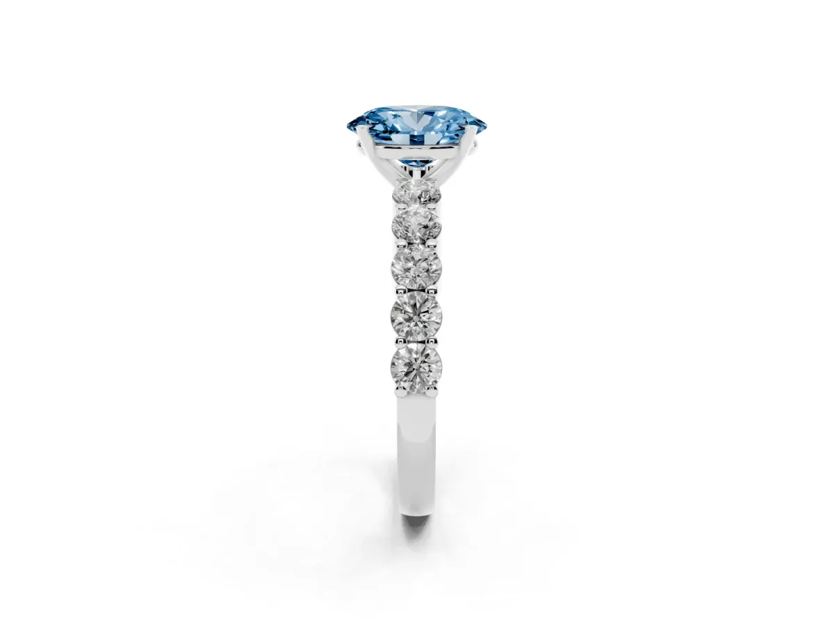 Fancy Blue Oval Cut Diamond Solitaire Ring with Shared Prong Round Side Stones Silver