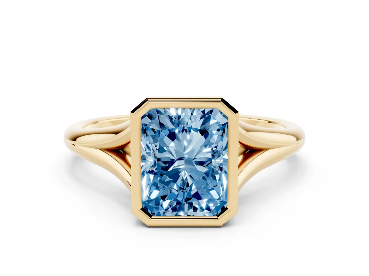 Fancy Blue Bezel Set Radiant Cut Cut Solitaire Ring with Tapered Band Yellow gold