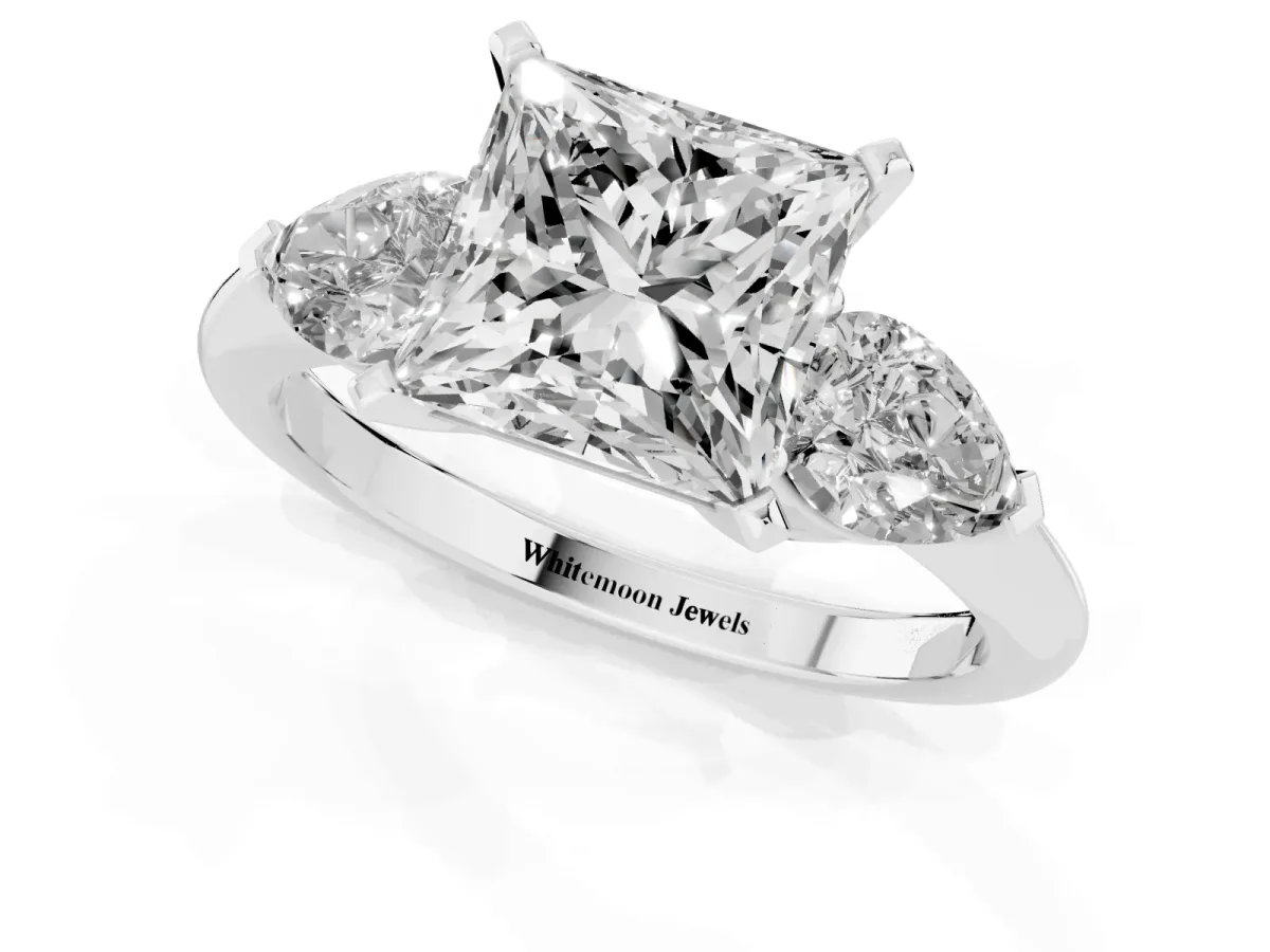 Three-Stone Princess Cut Diamond Ring with Pear Side Stones and Four-Prong Setting Platinum
