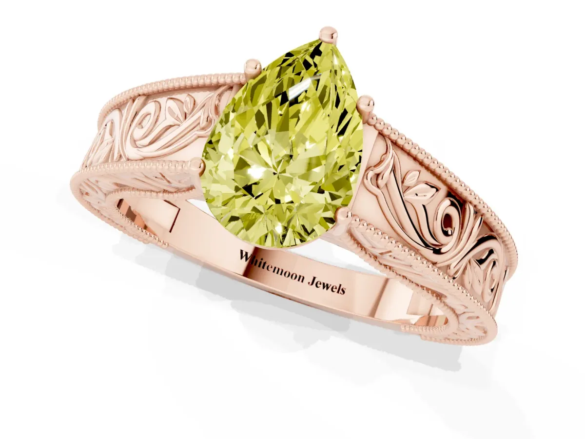 Fancy Yellow Pear Cut Diamond Solitaire Ring with Engraved Band and Four-Prong Setting Rose gold