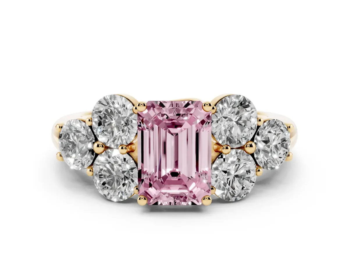 Fancy Pink Emerald Cut Cut Diamond Cluster Ring with Round Accent Stones and Prong Setting on a Classic Band Yellow gold