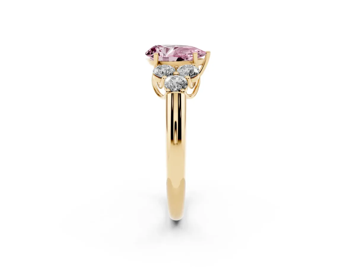 Fancy Pink Pear Cut Cut Diamond Cluster Ring with Round Accent Stones and Prong Setting on a Classic Band Yellow gold