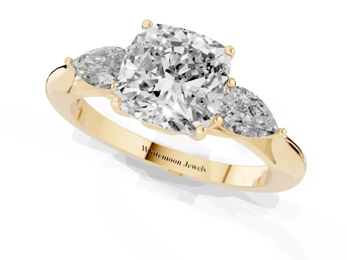 Three-Stone Cushion Cut Brilliant Diamond Solitaire Ring with Tapered Band and Four-Prong Setting Yellow gold