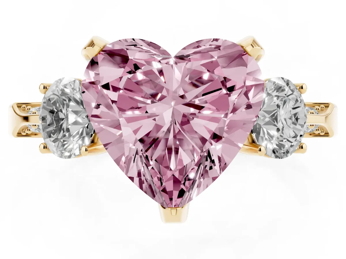 Fancy Pink Heart Cut Brilliant Three-Stone Diamond Ring with Pavé Band and Four-Prong Setting Yellow gold