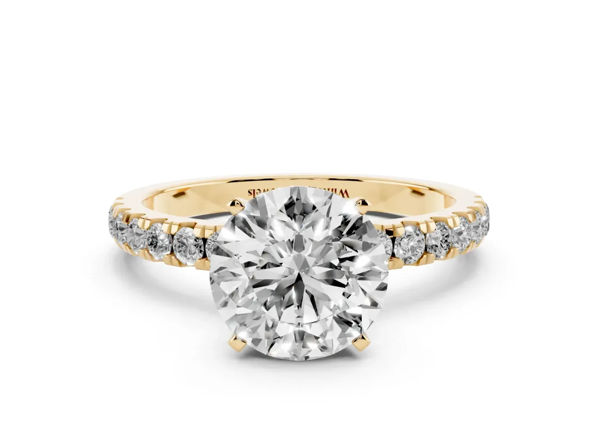 Round Cut Diamond Solitaire Ring with Pavé Accents and Four-Prong Setting Yellow gold