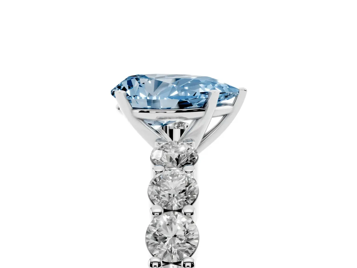Fancy Blue Pear Cut Diamond Solitaire Ring with Shared Prong Round Side Stones Platinum