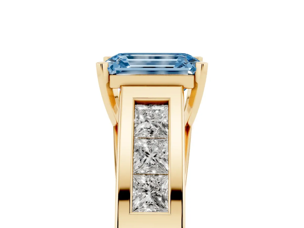 Fancy Blue Emerald Cut Cut Channel Set Solitaire Ring with Four-Prong Setting Yellow gold
