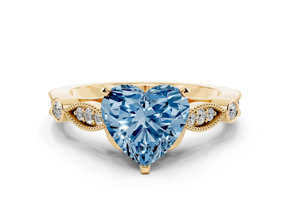 Fancy Blue Heart Cut Cut Diamond with Milgrain Marquise and Bezel Accents on a Solitaire Band with Prong Setting Yellow gold