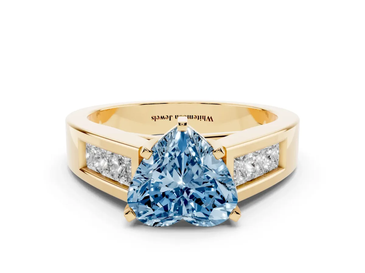 Fancy Blue Heart Cut Cut Channel Set Solitaire Ring with Four-Prong Setting Yellow gold