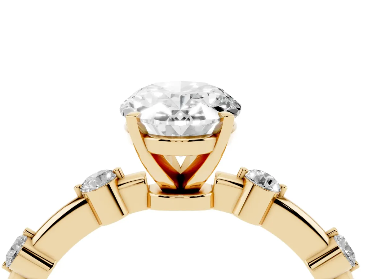 Oval Cut Solitaire Diamond Ring with Bezel Set Side Stones and Prong Setting Yellow gold