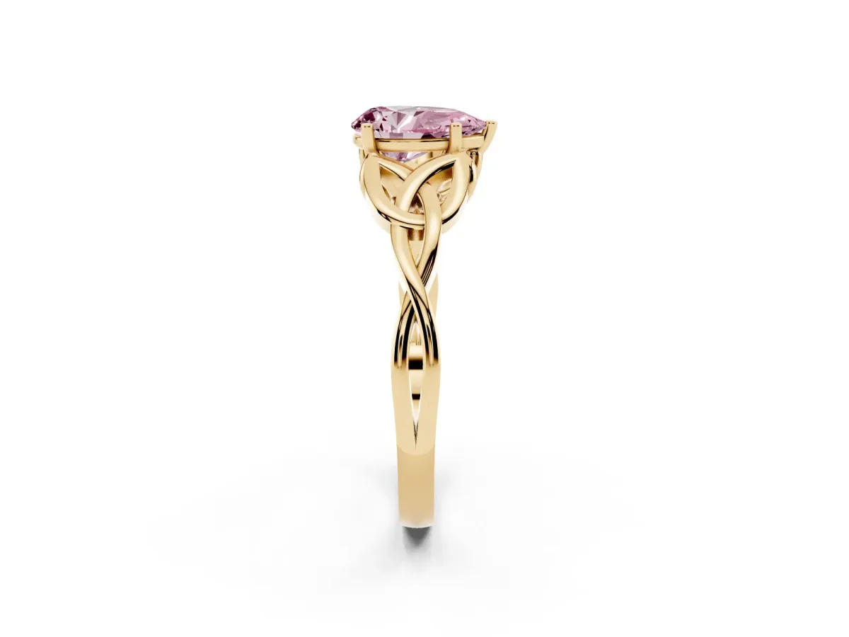 Fancy Pink Pear Cut Diamond Solitaire Engagement Ring with Celtic Knot Band and Four-Prong Setting Yellow gold