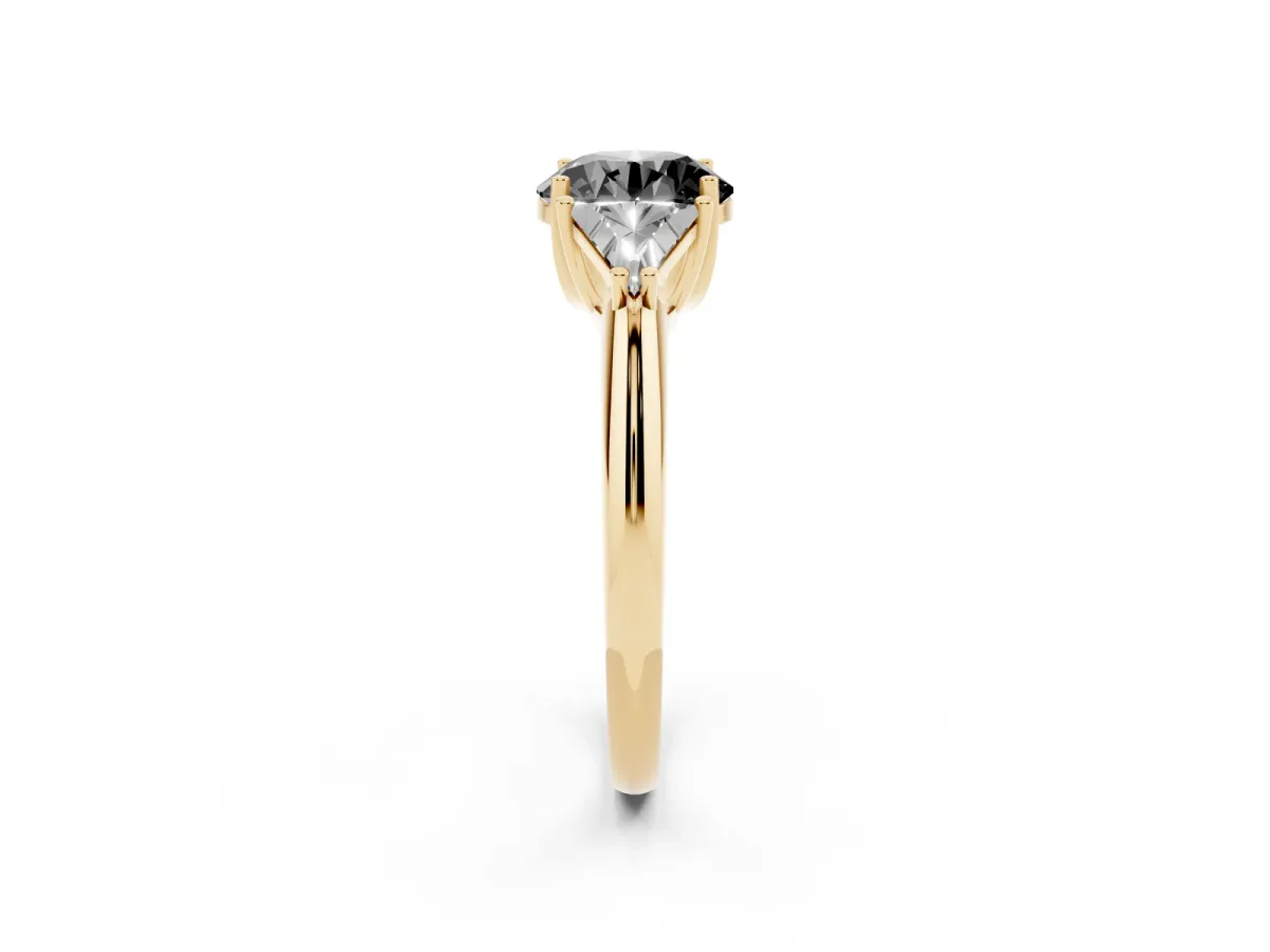 Fancy Black Three-Stone Round Cut Diamond Engagement Ring with Trillion Side Stones and Prong Setting Yellow gold