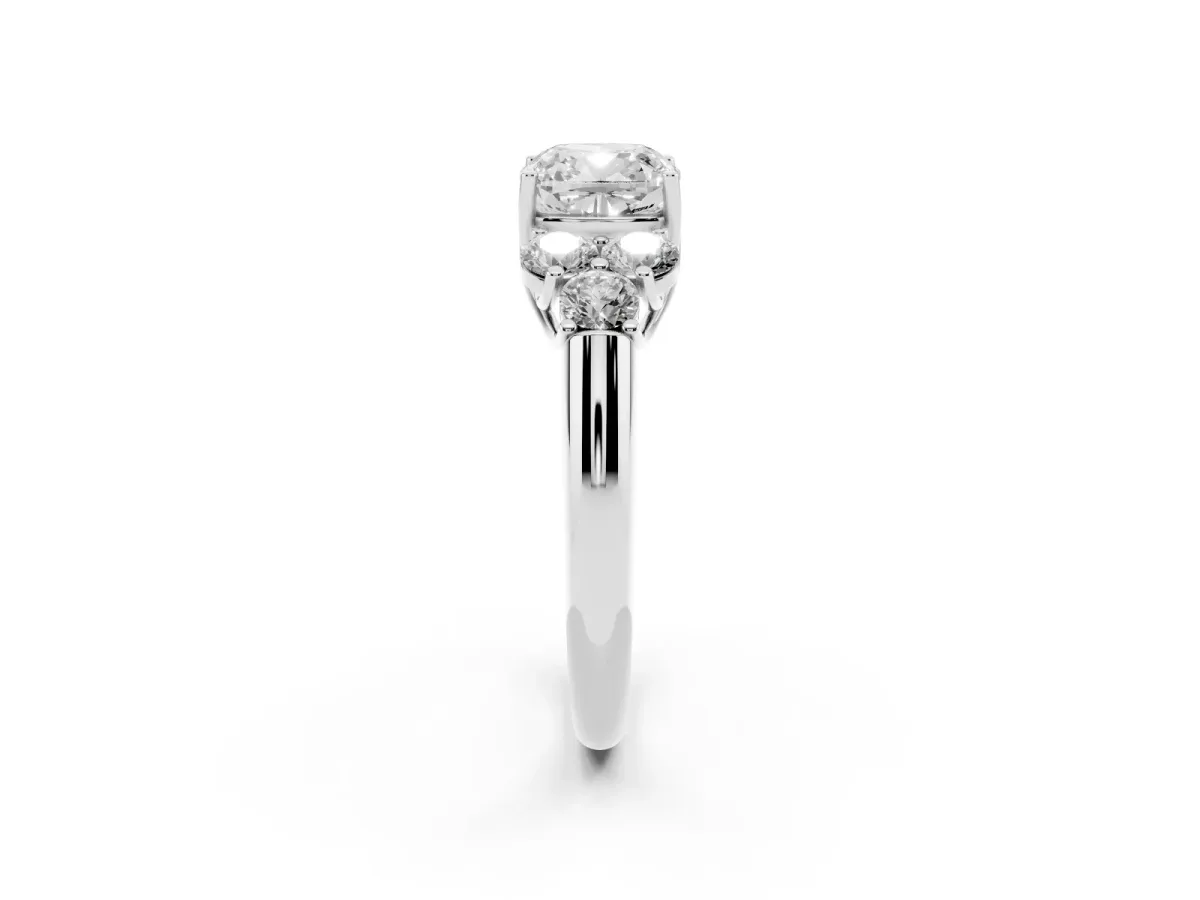 Cushion Cut Cut Diamond Cluster Ring with Round Accent Stones and Prong Setting on a Classic Band Silver