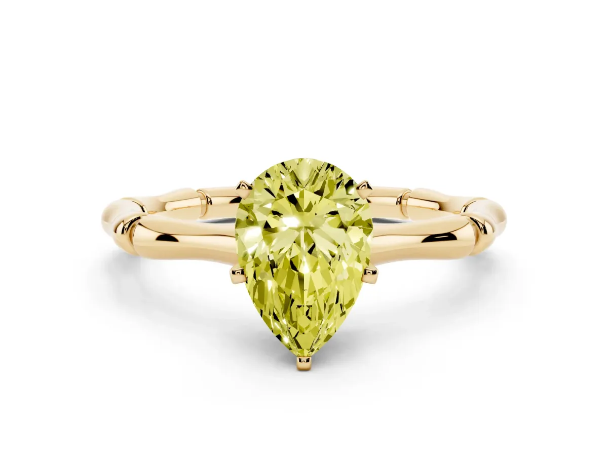 Fancy Yellow Pear Cut Solitaire Diamond Ring with Bamboo Band and Four-Prong Setting Yellow gold