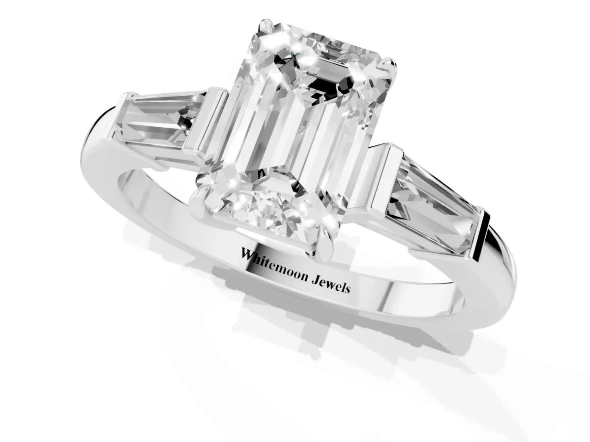 Emerald Cut Diamond Three-Stone Ring with Tapered Baguette Side Stones and Prong Setting White gold