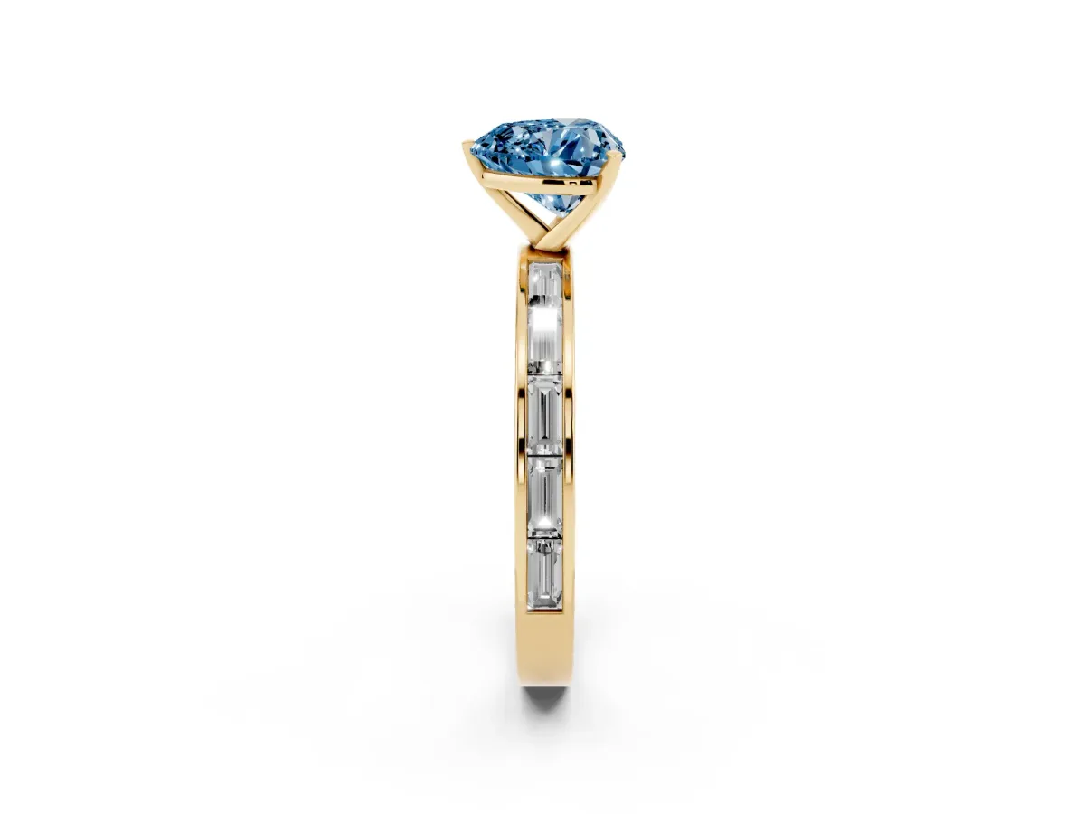 Fancy Blue Heart Cut Solitaire Diamond Ring with Channel-Set Baguette Band and Four-Prong Setting Yellow gold