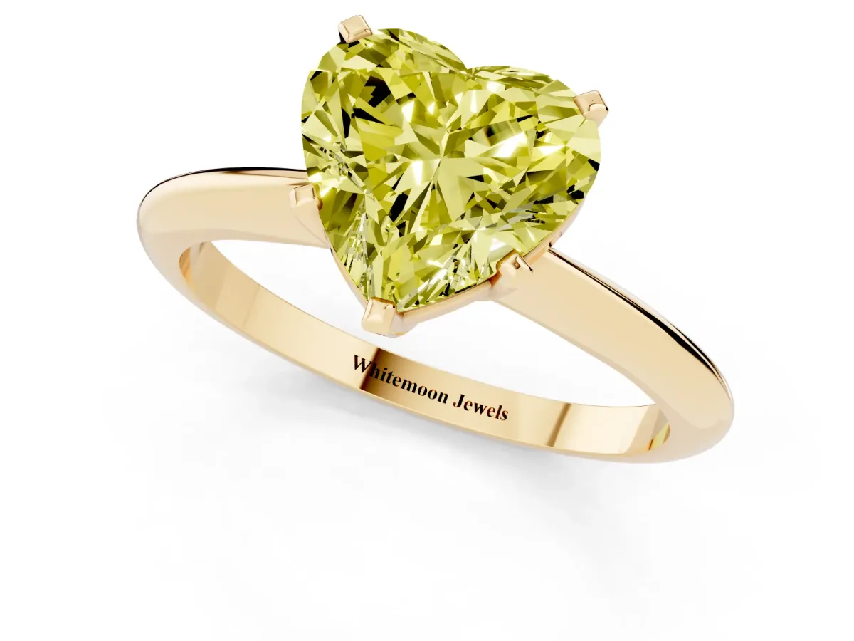 Fancy Yellow Heart Cut Cut Solitaire Ring with Four-Prong Setting on a Classic Band Yellow gold