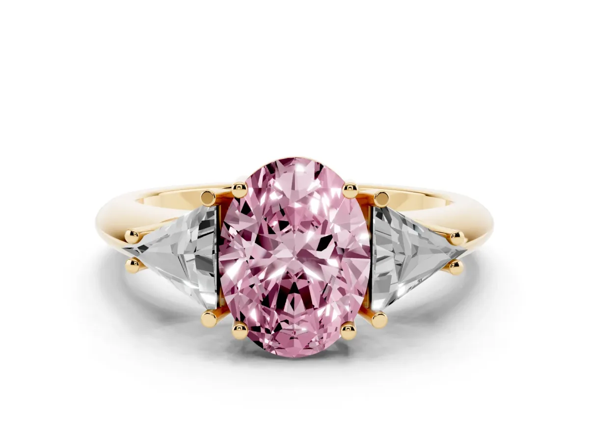 Fancy Pink Three-Stone Oval Cut Diamond Engagement Ring with Trillion Side Stones and Prong Setting Yellow gold