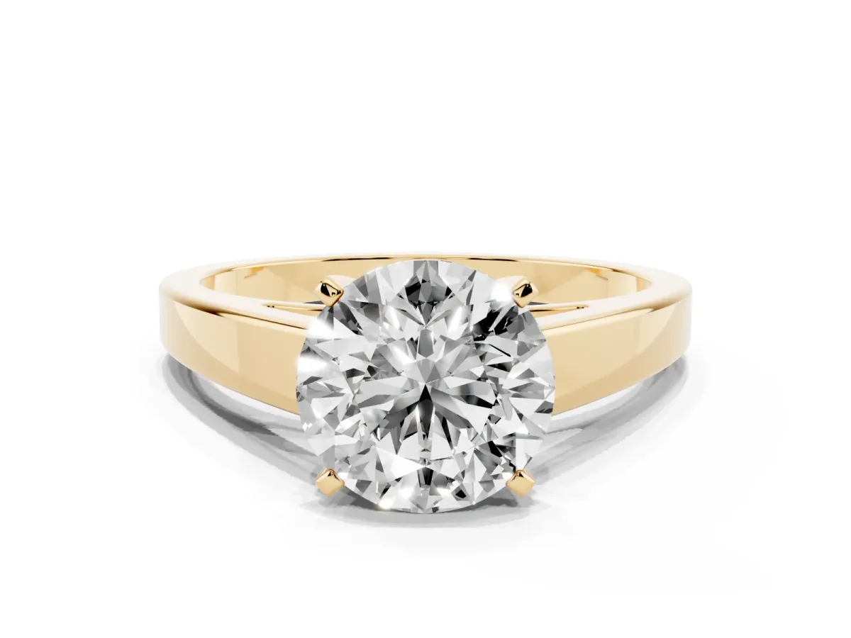 Round Cut Solitaire Engagement Ring with Four-Prong Setting and Tapered Band Yellow gold