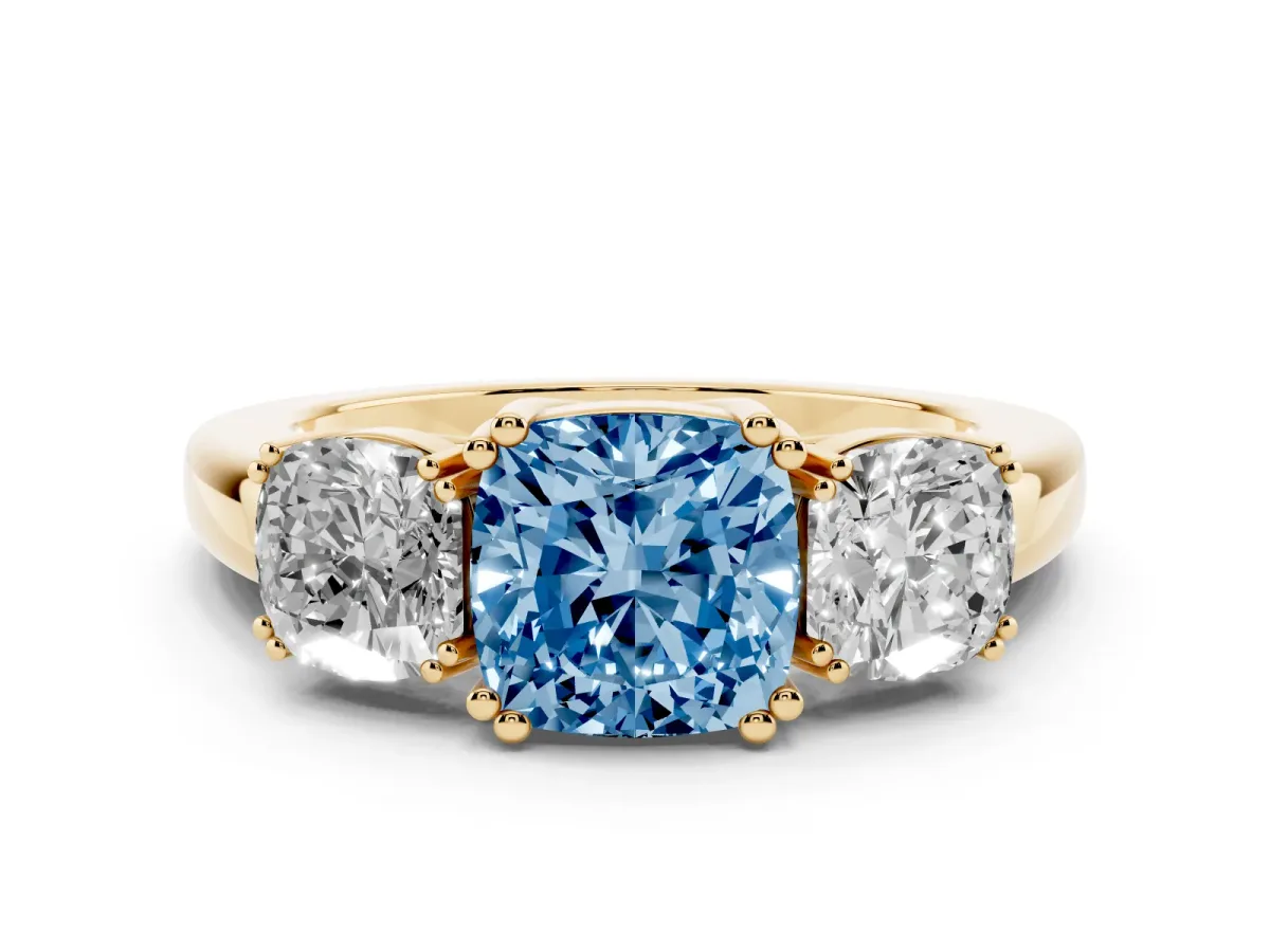 Fancy Blue Three-Stone Cushion Cut Cut Diamond Ring with Channel Set Band and Four-Prong Setting Yellow gold