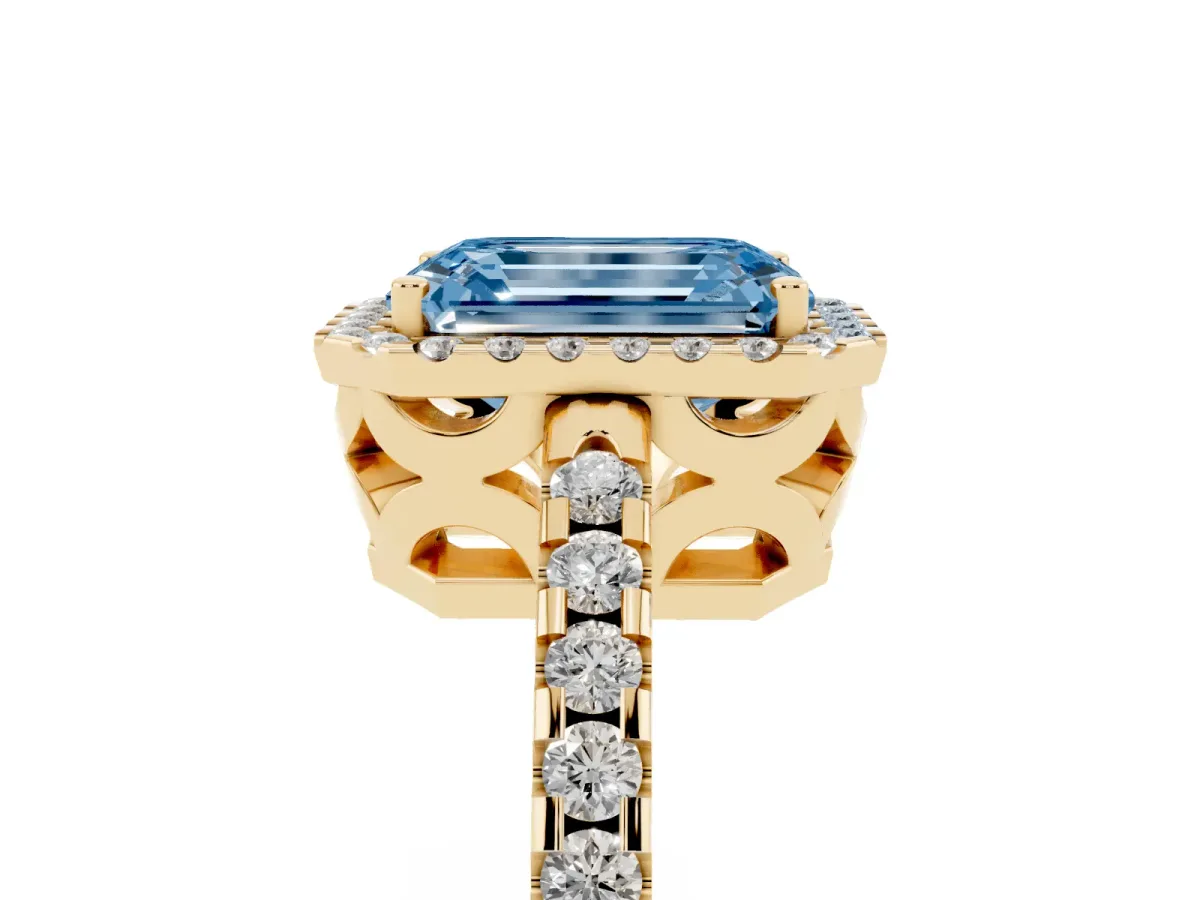 Fancy Blue Emerald Cut Diamond Halo Engagement Ring with Pavé Band and Prong Setting Yellow gold