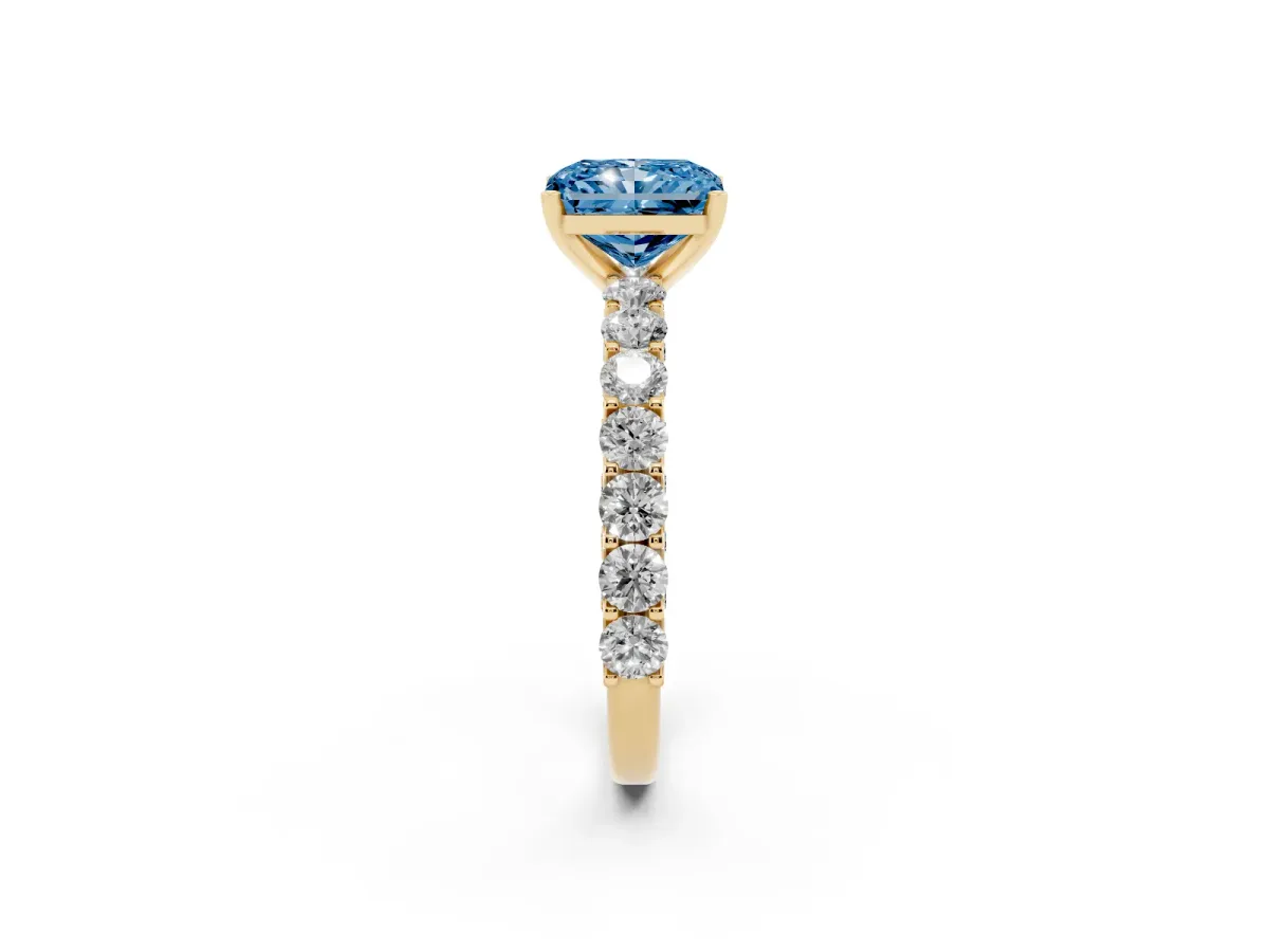 Fancy Blue Radiant Cut Diamond Solitaire Ring with Shared Prong Pavé Band and Four-Prong Setting Yellow gold