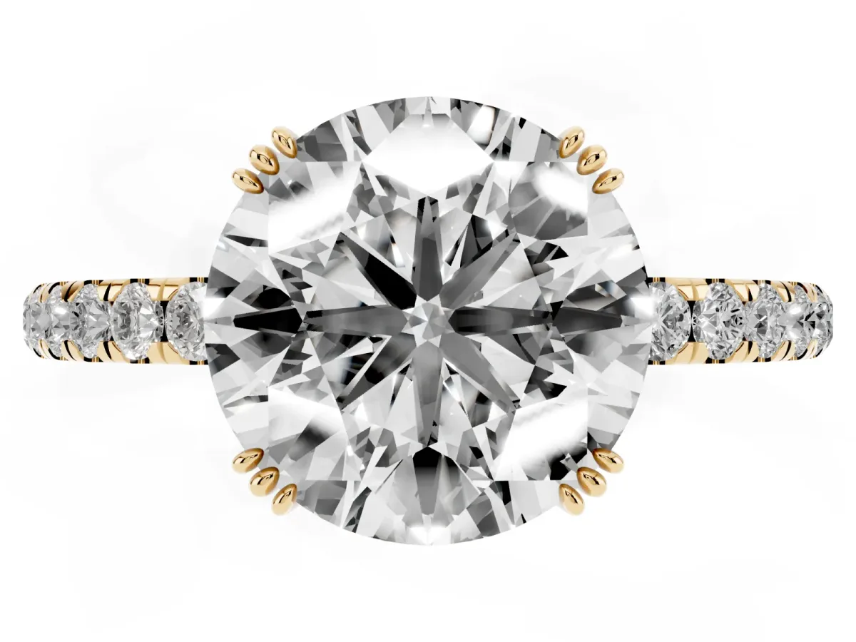 Round Cut Brilliant Solitaire with Pavé Band and Claw Prong Setting Yellow gold