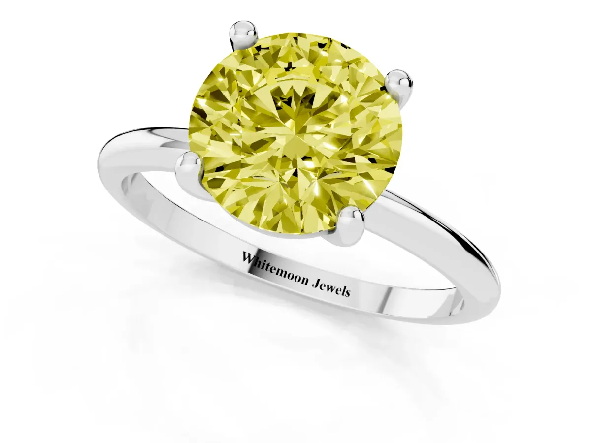 Fancy Yellow Round Cut Solitaire Diamond Ring with 4-Prong Setting on a Classic Band Silver