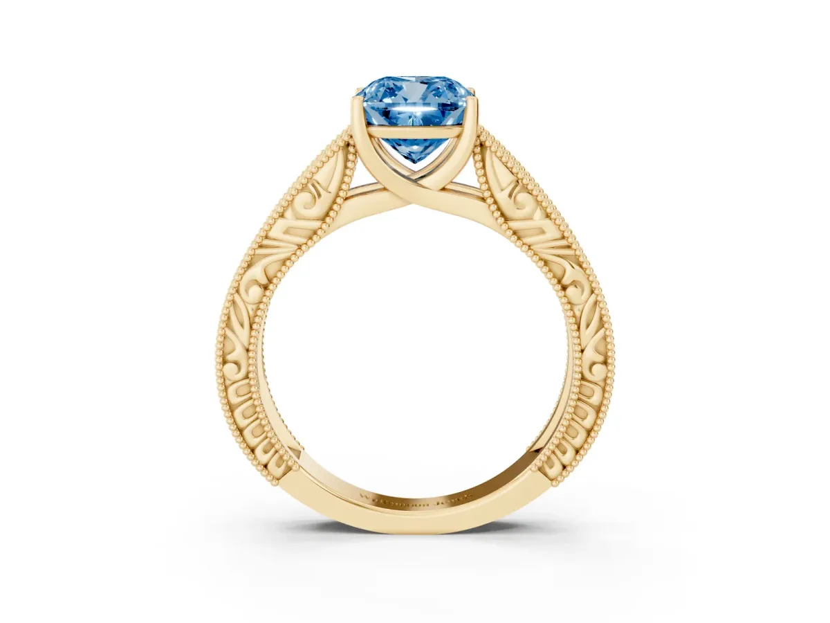 Fancy Blue Cushion Cut Diamond Solitaire Ring with Engraved Band and Four-Prong Setting Yellow gold