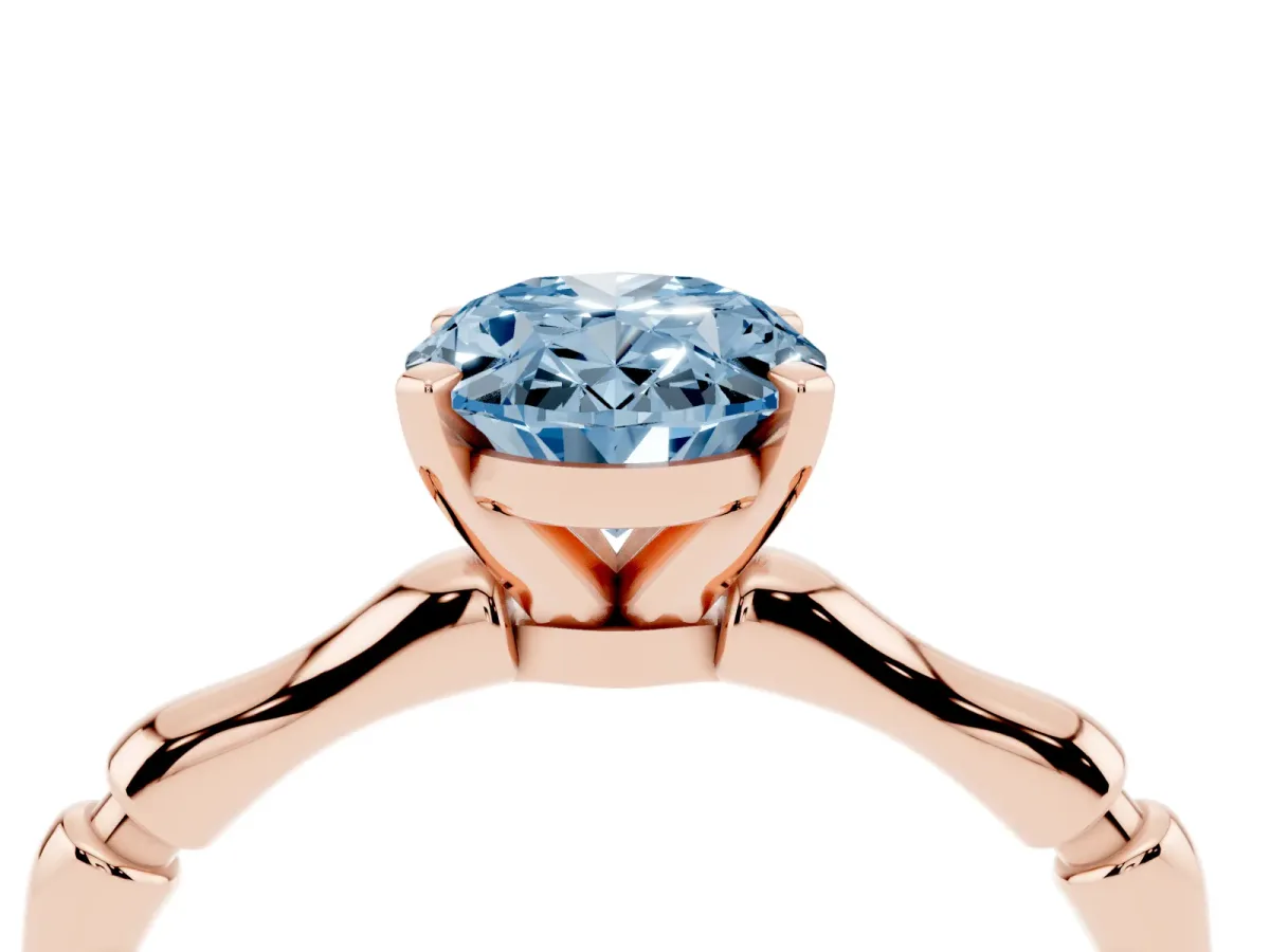 Fancy Blue Oval Cut Solitaire Diamond Ring with Bamboo Band and Four-Prong Setting Rose gold