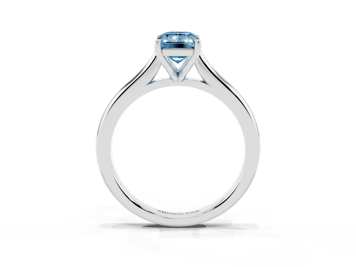 Fancy Blue Emerald Cut Cut Solitaire Ring with Cathedral Band and Four-Prong Setting Silver