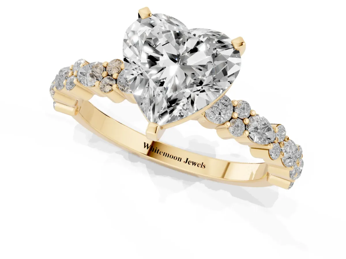 Heart Cut Diamond Side Stone Solitaire Ring with Round and Four-Prong Setting Yellow gold