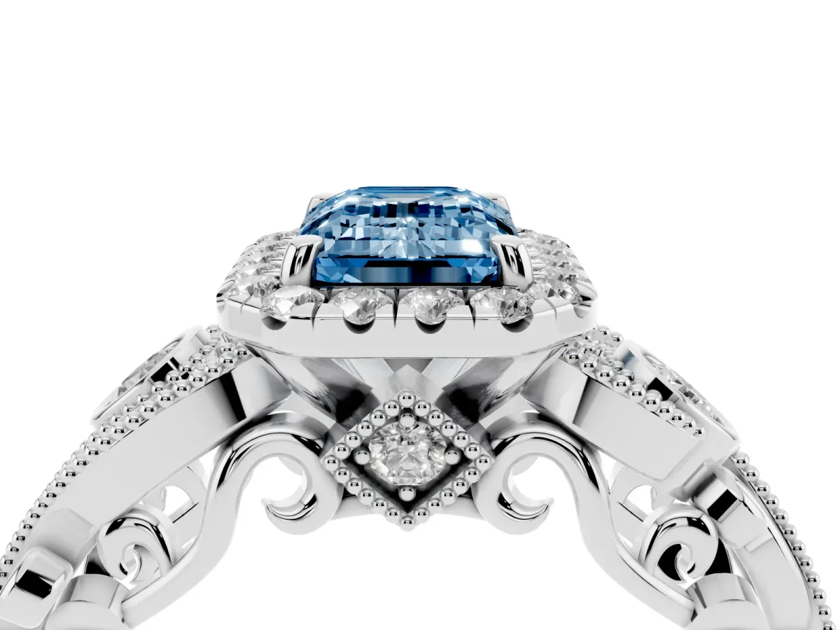 Fancy Blue Emerald Cut Halo Diamond Ring with Milgrain and Bezel Accents on a Split Shank Band White gold