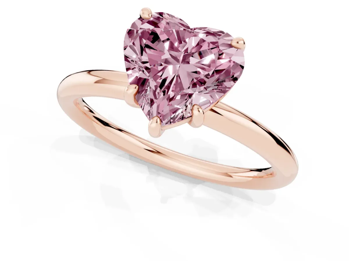 Fancy Pink Heart Cut Solitaire Diamond Ring with Four-Prong Setting on a Plain Band Rose gold
