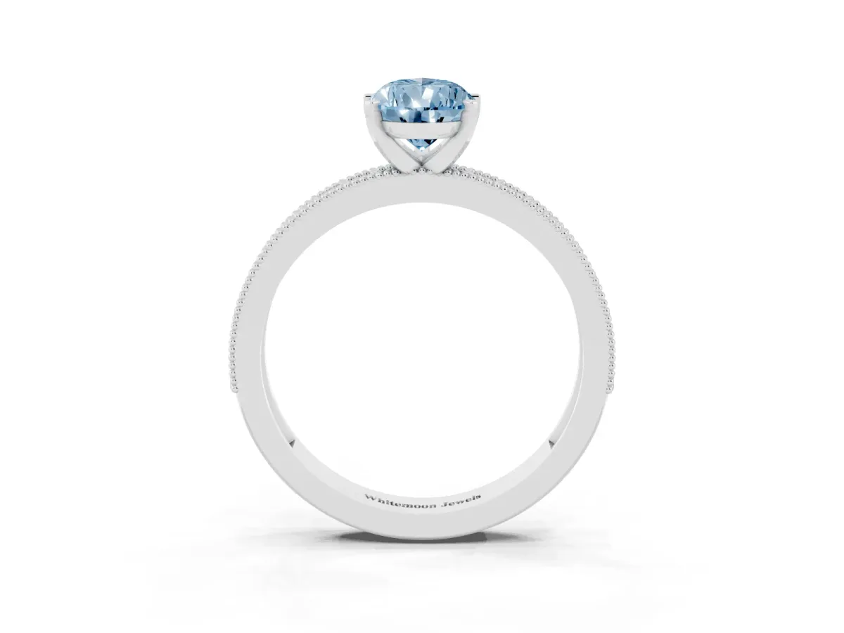 Fancy Blue Pear Cut Diamond Milgrain Pavé Engagement Ring with Four-Prong Setting Platinum