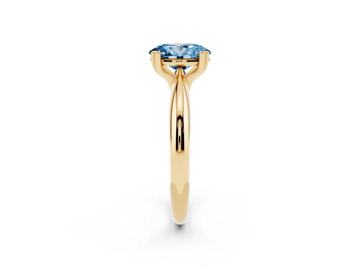 Fancy Blue Oval Cut Cut Solitaire Engagement Ring with Tapered Band and Four-Prong Setting Yellow gold