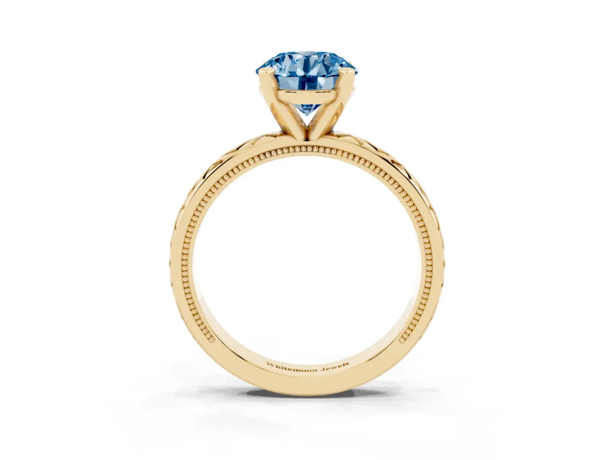 Fancy Blue Round Cut Solitaire Diamond Ring with Milgrain and Black Enamel X Pattern Band Yellow gold