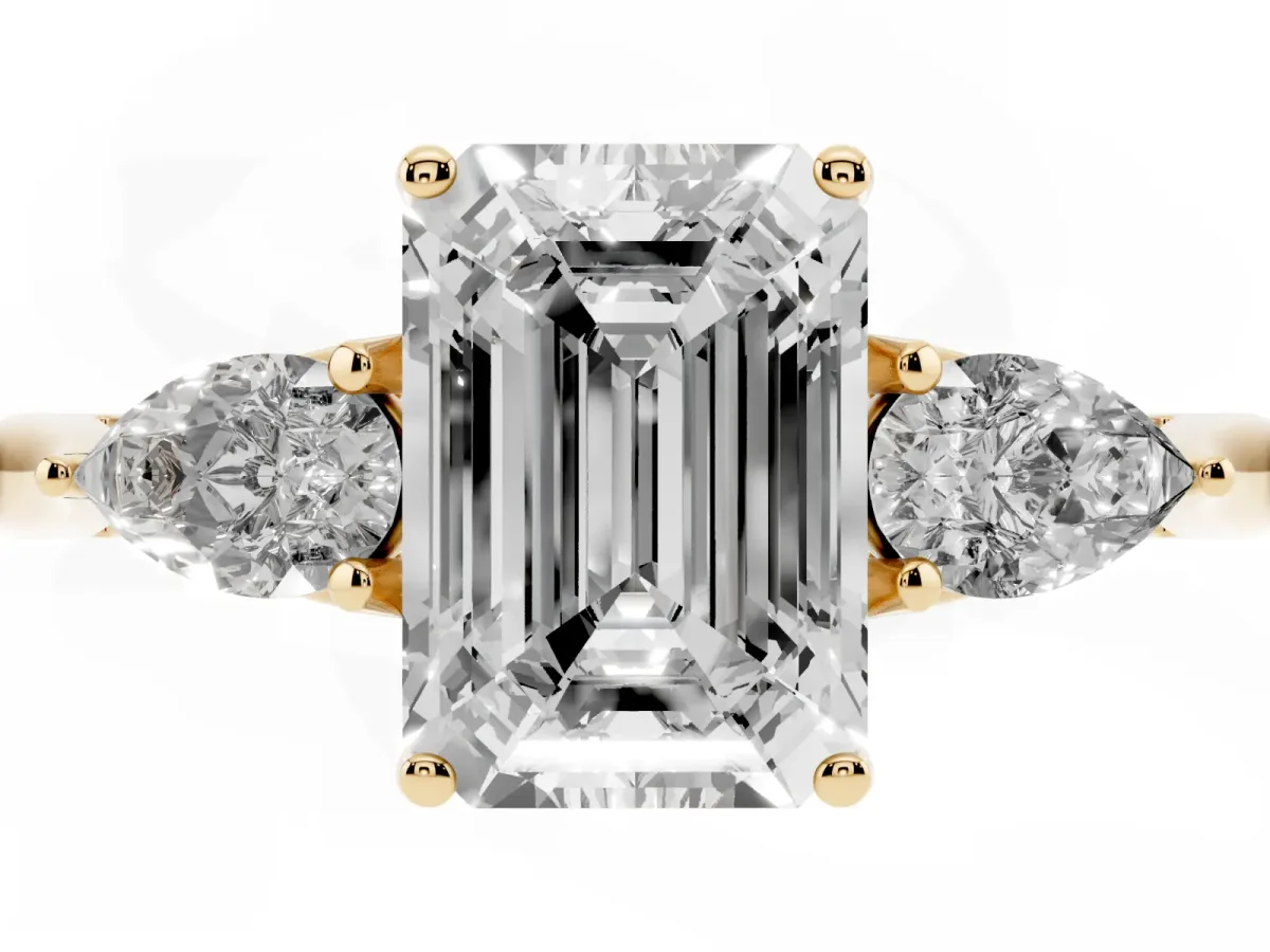 Emerald Cut Diamond Three-Stone Ring with Pear Side Stones and Prong Setting Yellow gold