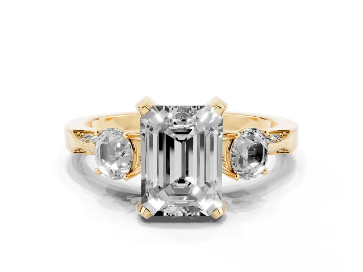 Fancy Pink Emerald Cut Brilliant Three-Stone Diamond Ring with Pavé Band and Four-Prong Setting Yellow gold