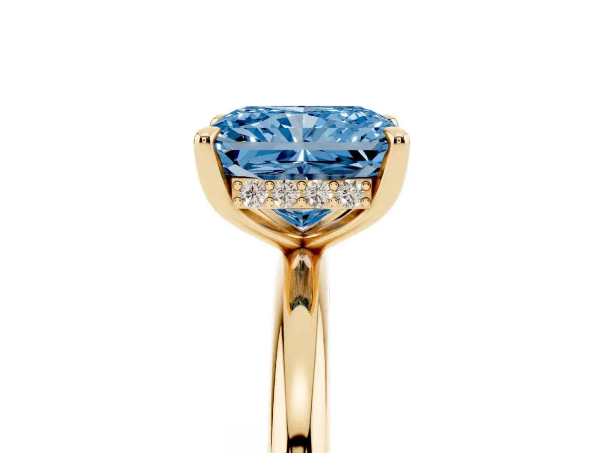 Fancy Blue Radiant Cut Diamond Solitaire Ring with Thin Band and Four-Prong Setting Yellow gold