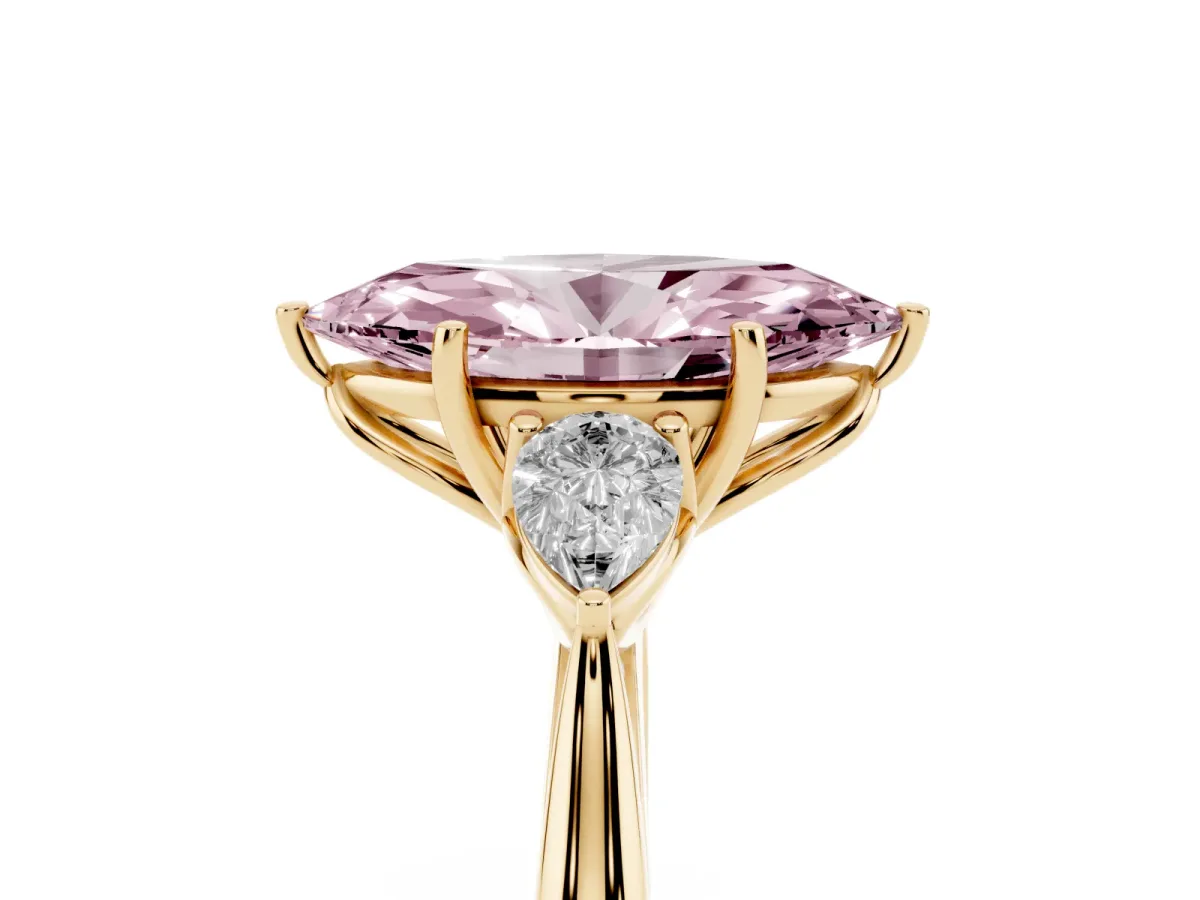 Fancy Pink Three-Stone Marquise Cut Brilliant Diamond Solitaire Ring with Tapered Band and Four-Prong Setting Yellow gold